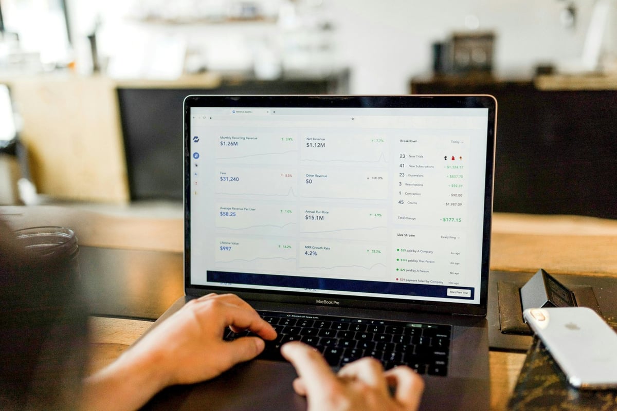 Business owner setting up online payments on laptop