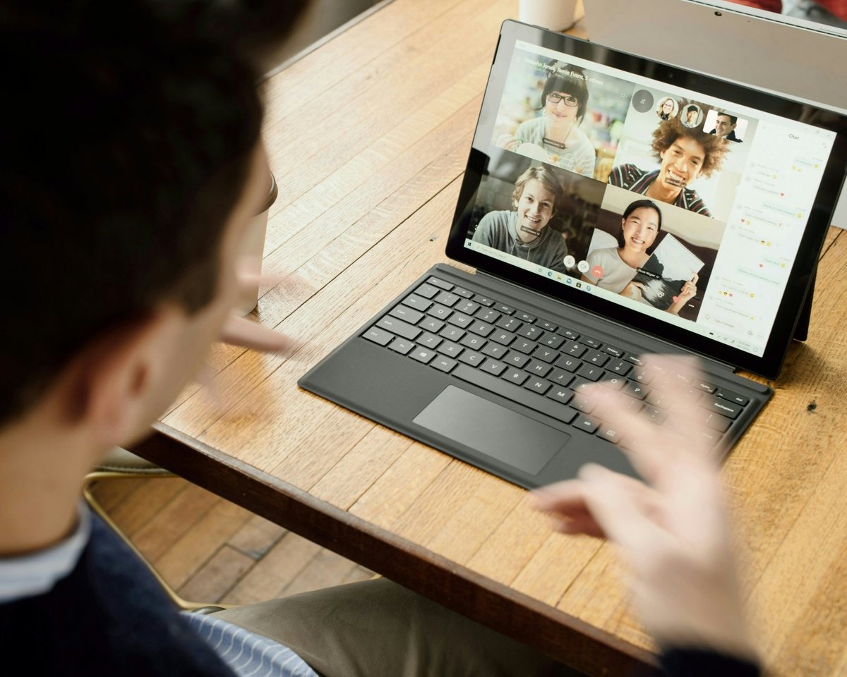Online tutor using a laptop to manage lessons and payments