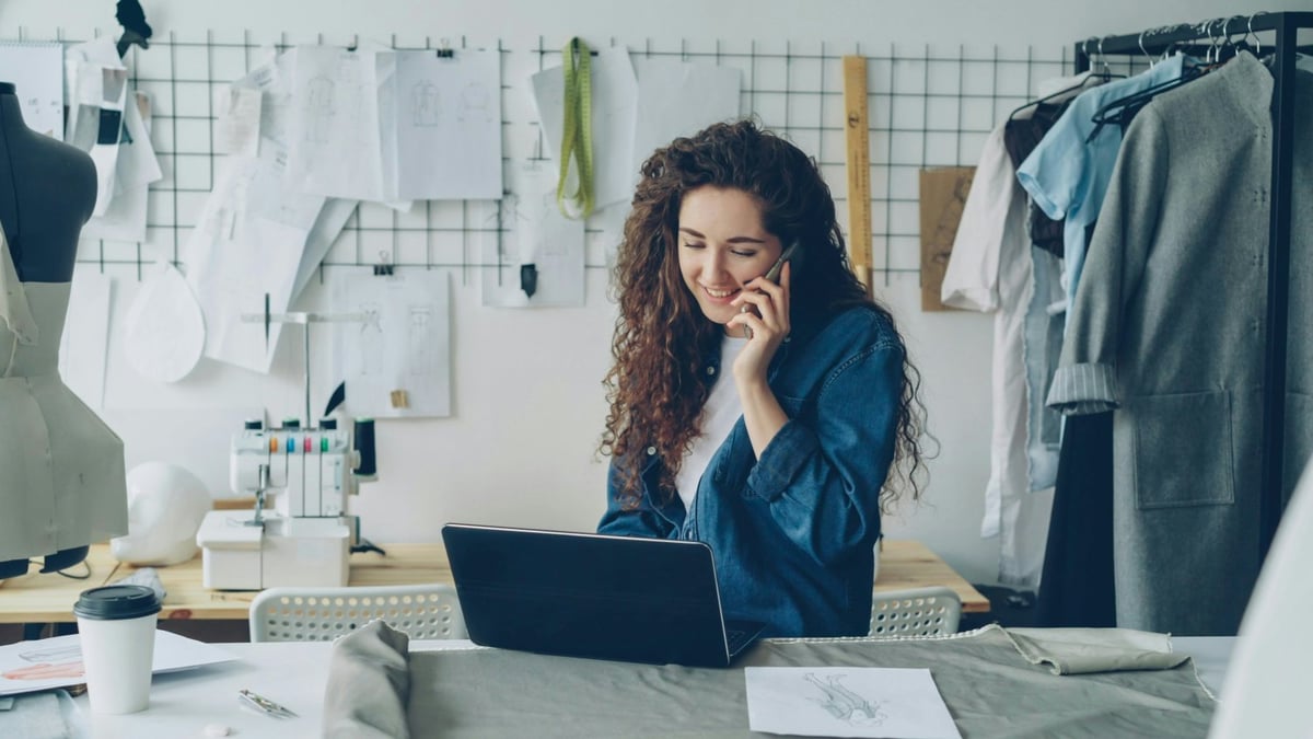 small business owner managing payments on laptop